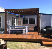 Shellharbour Beach Cottage - walk onto Patrolled beach with flags in summer - Accommodation Port Macquarie