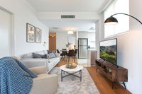 Tidy Apartment with Balcony and Parking Near Trains